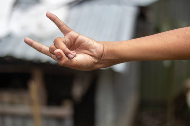istock A man pointing two fingers of his hand forward and blur background 1824617571