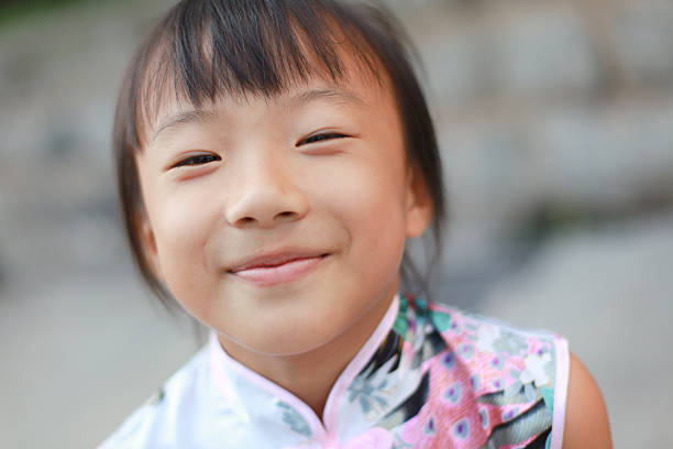 istock Cute Little Asian Girl Looking at Camera 182461938