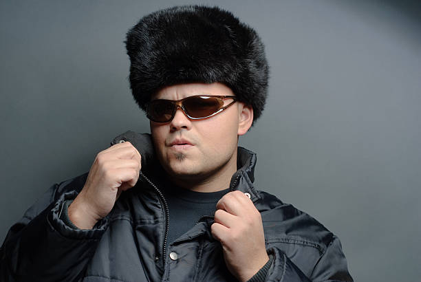 istock Man in fur hat and sunglasses with style 182461953