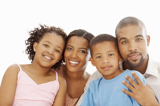 istock Family smiling against white background 182462319