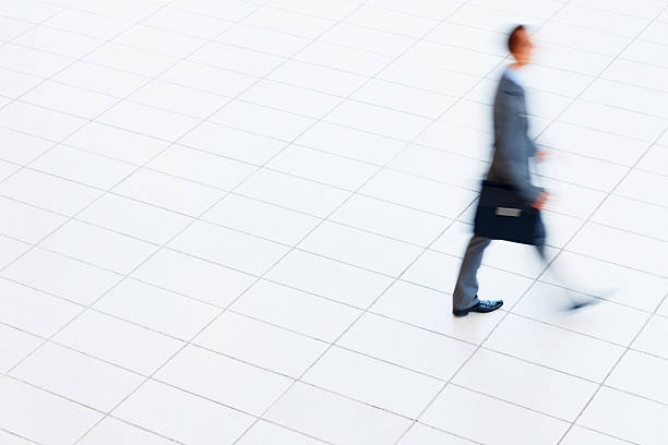 istock Business man walking in hurry with a briefcase 182462700