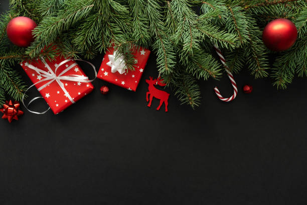 istock Christmas gift boxes, tree branches, baubles ornaments and decorations. Festive presents composition with copy space. 1824627605