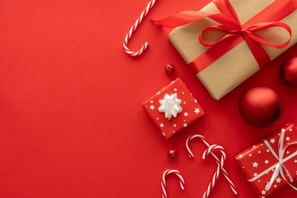 istock Christmas gifts and decorations, festive flat lay composition with copy space on red background. 1824628177