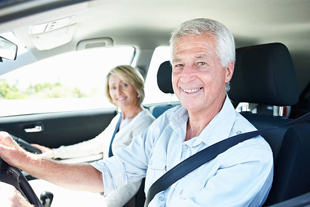 istock Smiling senior couple enjoying a car ride 182463251
