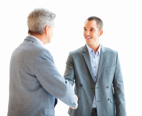 close up. firm business handshake on a blurry office background. concept of partnership