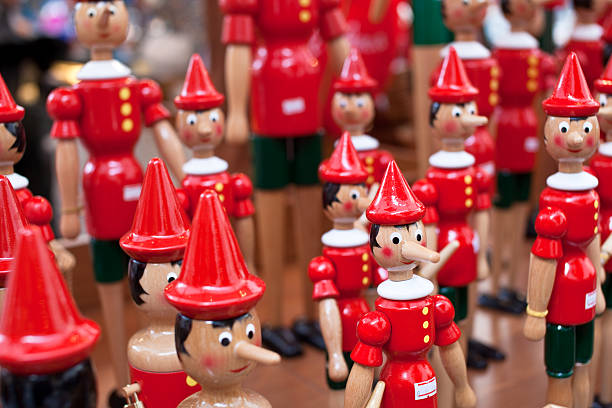 istock Pinocchio, italian wooden puppet 182463378
