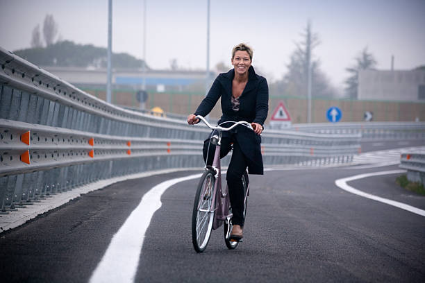 istock Woman in bycicle 182463440