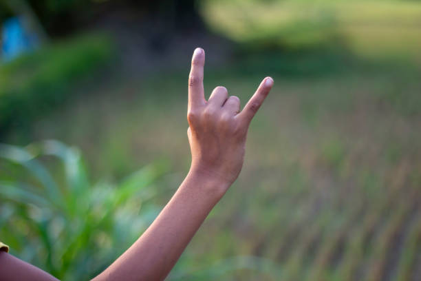 istock A man pointing two fingers of his hand forward and blur background 1824635099