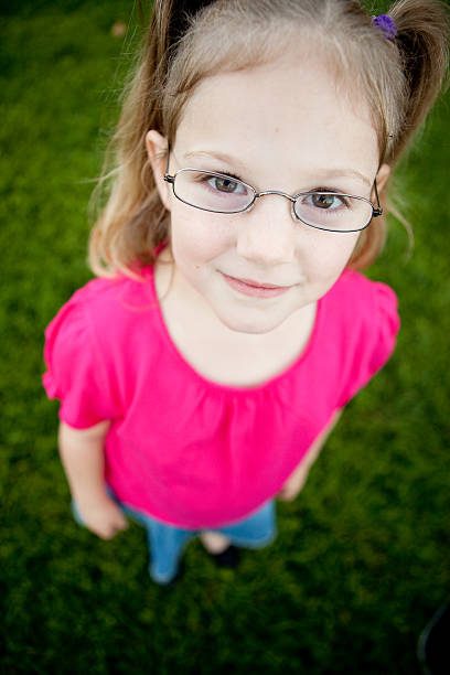 istock Happy Girl Wearing Glasses Outside 182463573