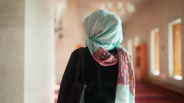 istock Multiracial female tourist visiting and walking in mosque 1824636211