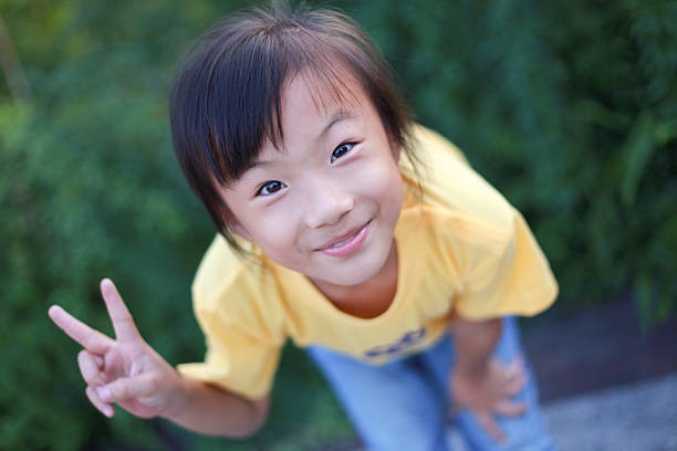 istock Cute Little Asian Girl Looking at Camera 182463767