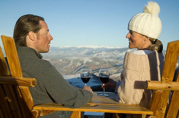 istock Couple drinking wine in winter with mountain background 182463769