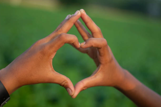 istock A man made a love sign with his hand and blurred background 1824640179