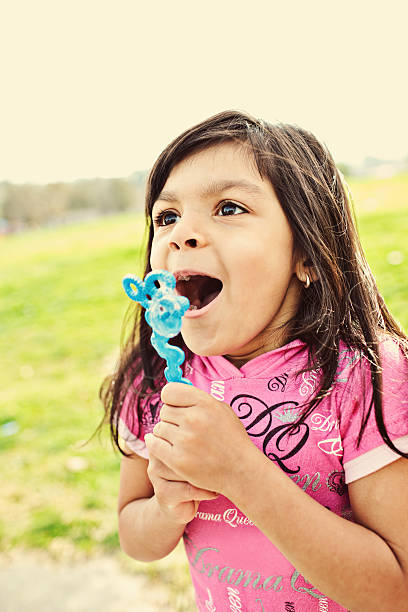 istock cute girl about to blow bubbles 182464525