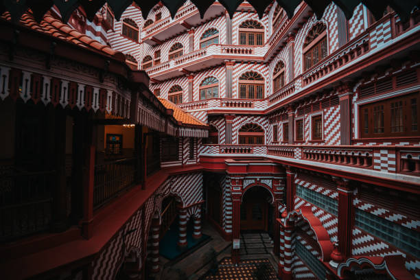 The read and white exterior of the Jami Ul-Alfar Mosque in Colombo, Sri Lanka.