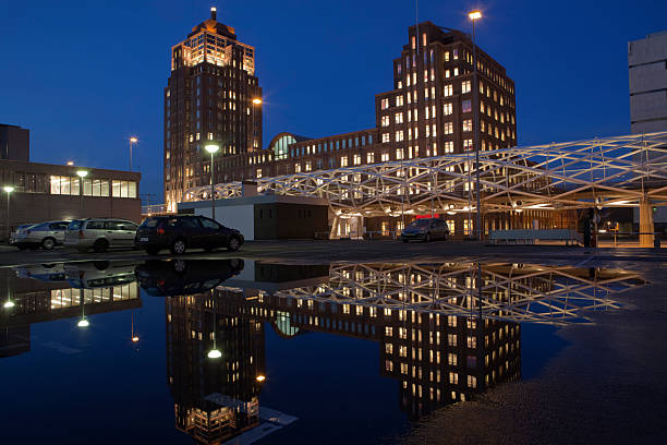 istock office building and its reflection in a pool of water 182464762