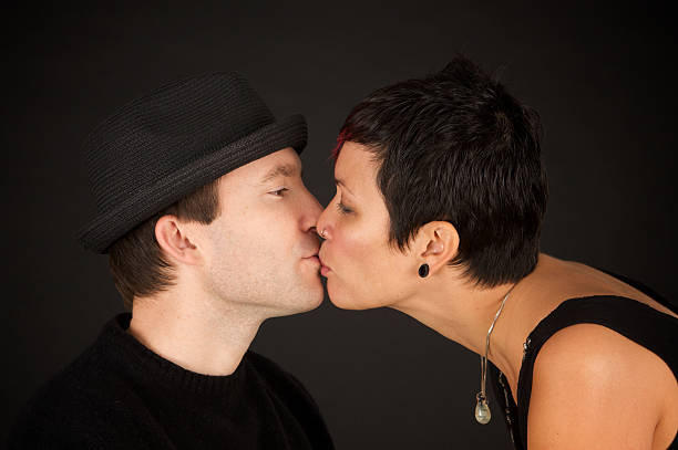 istock Cool Kissing Couple on Black Background 182464837