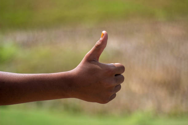 istock A man has his thumb pointing up and blurred background 1824650196
