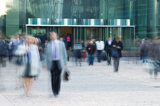istock Business People Leaving Office Building, Blurred Motion 182465098