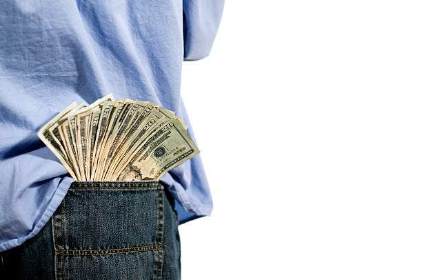man with money in his back pocket stock photo