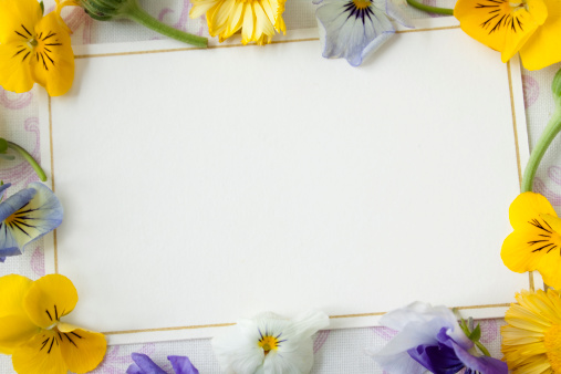 A blank card with fresh flowers.