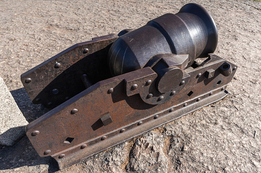 Rusty ancient mortar gun, close up photo