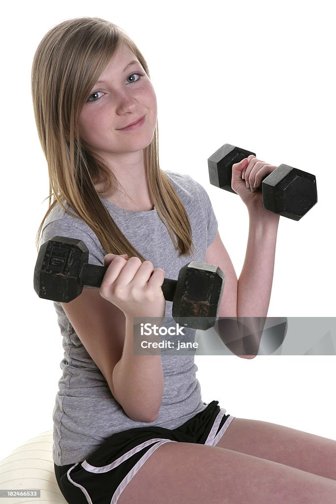 Chica con pesas - Foto de stock de 14-15 años libre de derechos