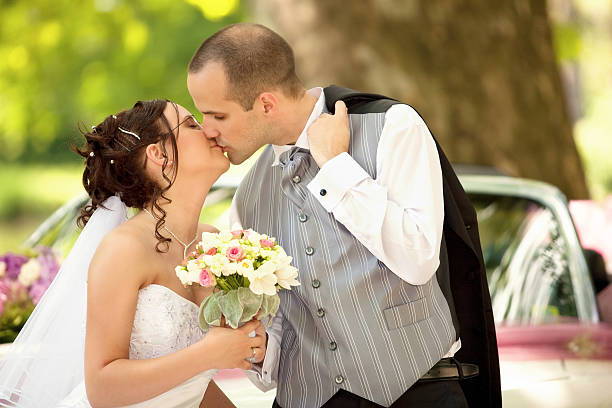 istock just married couple with car by the lake 182466722