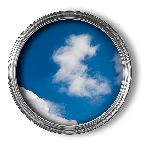 Blue sky and clouds in an open tin of paint