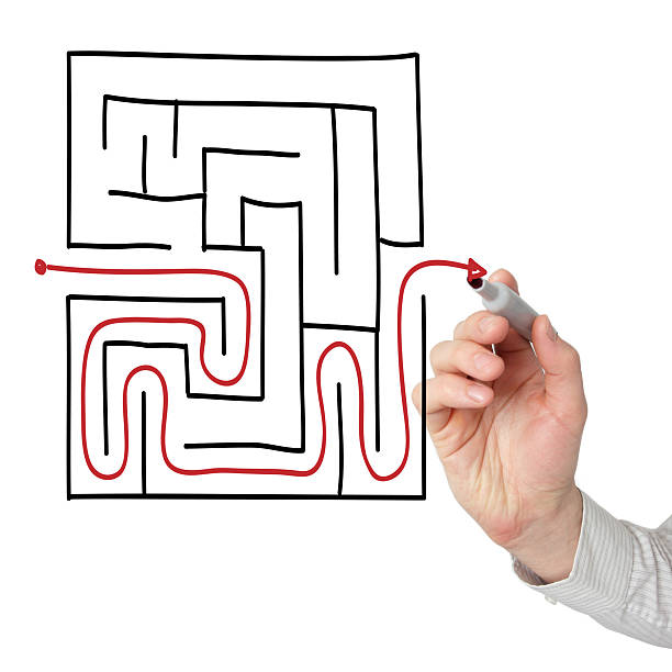 istock Man drawing the way out through a maze 182466998