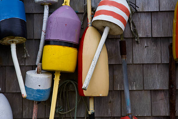 istock Small group of lobster buoys hanging on wall 182467411