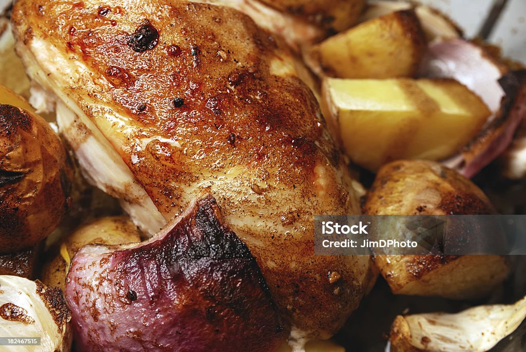Chicken with balsamic glaze "A rustic chicken with a balsamic glaze. Also in the dish are potatoes, garlic and Bermuda onions." Baked Stock Photo