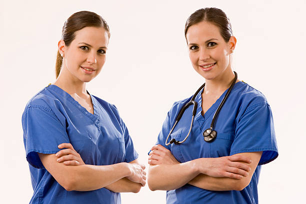 istock Female doctor smiling with arms crossed 182467662