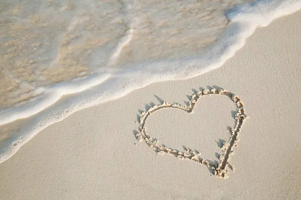 Photo of Love on the Beach—Heart Drawn in Sand