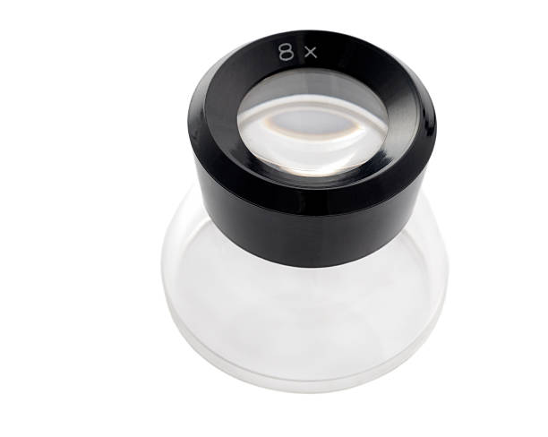 Magnifying magnifying magnifying glass "Photographers use loupes to review, edit or analyze negatives and slides on a light table. They can be used for many other things." photography loupe stock pictures, royalty-free photos & images
