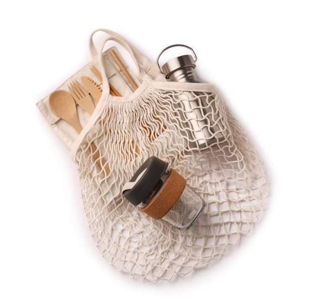 istock Fishnet bag with different items isolated on white, top view. Conscious consumption 1824683478