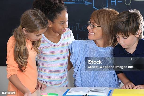 Friendly Teacher Stock Photo - Download Image Now - 10-11 Years, 40-49 Years, Adult