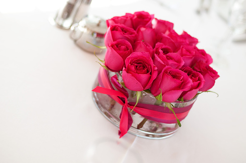 Bouquet of red roses, hearts and candles on white background. Valentine's day February 14. Place for your text.