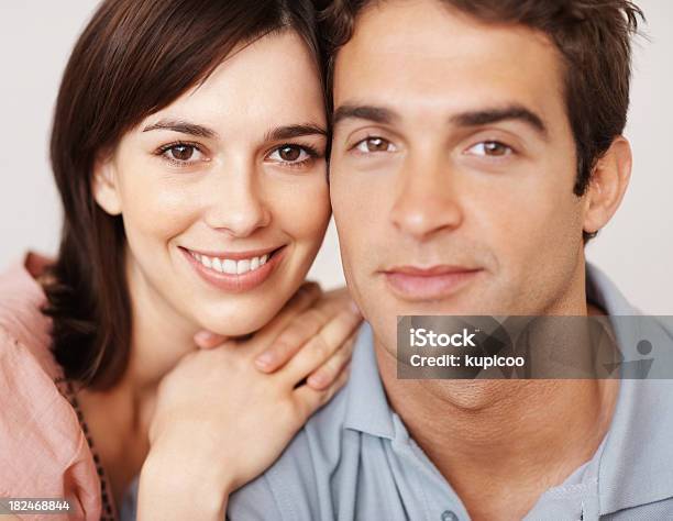 Closeup Of An Attractive Young Couple Looking At You Stock Photo - Download Image Now