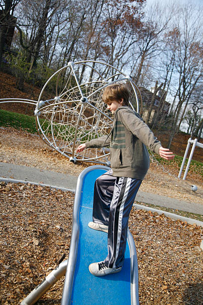 istock Young Teenage Boy Playing in Park 182468956