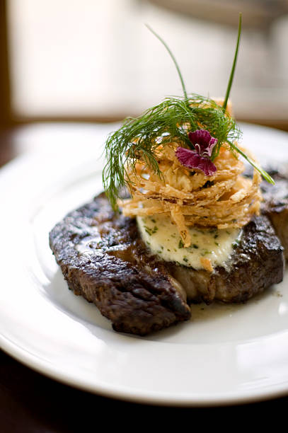 istock Grilled steak topped with crispy fried onions and herb butter 182469068