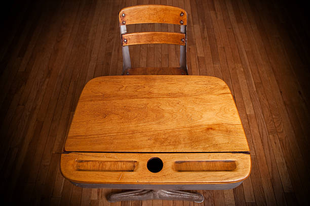 istock Empty Old School Desk on Hardwood Floor 182469108