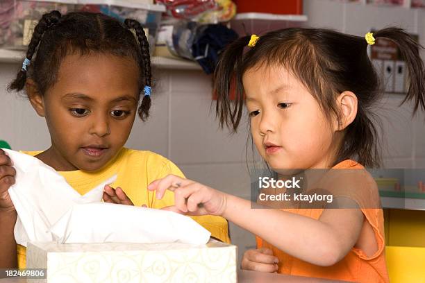 Preschoolers Grabbing Tissues Stock Photo - Download Image Now - Classroom, Facial Tissue, 2-3 Years