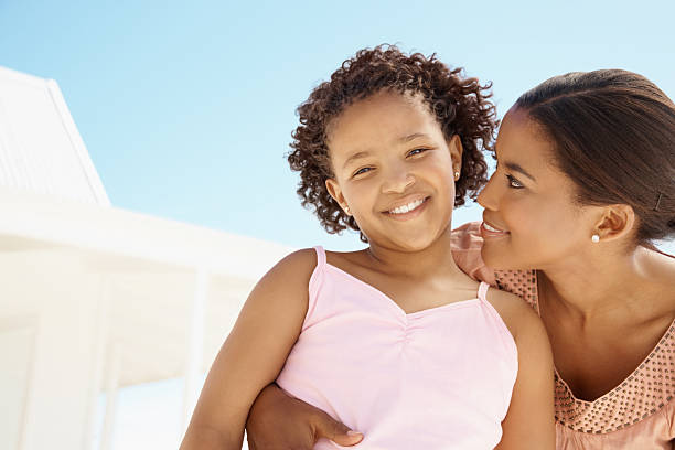 istock Mother smiling with her daughter 182471031