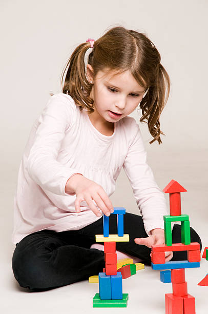 istock little girl playing 182471043