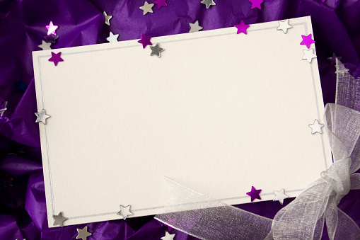 Blank note card with stars and ribbon.