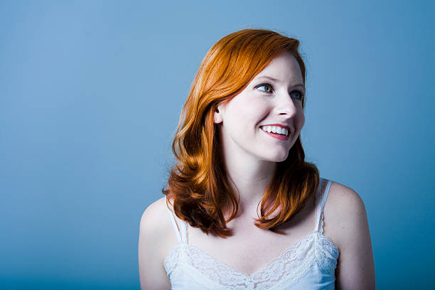 istock Redheaded young woman looking to the side 182471588