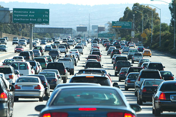 Cars in a traffic jam in Los Angeles, California A traffic jam on the 405 freeway in LA California. traffic jam stock pictures, royalty-free photos & images