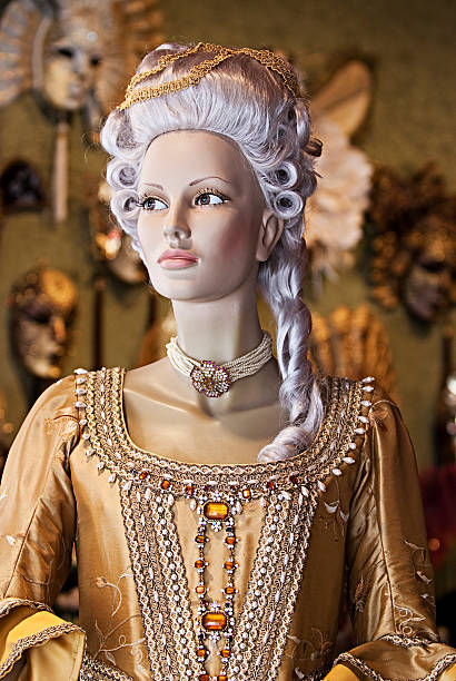 Venice, Italy - March 01, 2025: An elaborately dressed performer poses beside a decorative column during the vibrant Venice Carnival, showcasing rich cultural heritage.