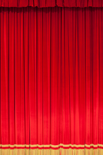 Close up of a red curtain in a classical theatre with golden details.Adobe RGB (1998) colour profile for a better control of the red.